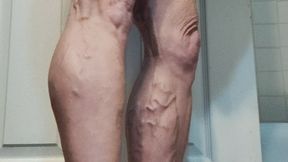 Tempest doing calf raises in bathroom