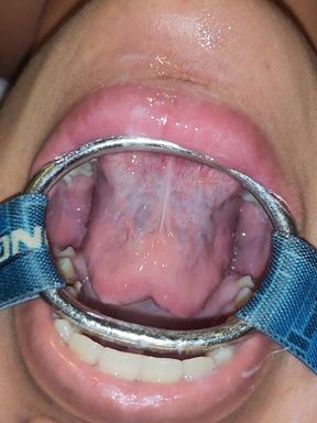 Putting It in Her Pussy and Then Straight Into Her Mouth with a Spider Gag in Her Open Mouth