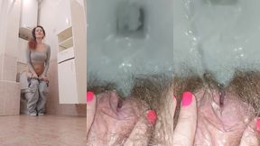 pissing woman in the toilet