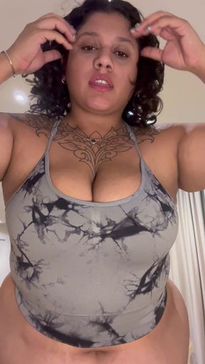 Curvy black pro model strikes a pose in her swimwear