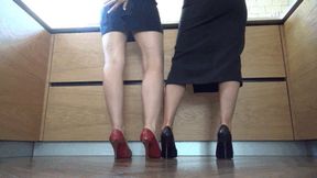 M Two air hostess who are girlfriends playing footsie in heels WSH