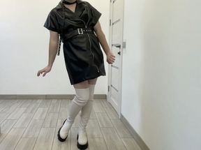 BDSM crossdresser in overknee boots and leather dress