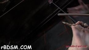 Gagged angel is hoisted up previous to hard pussy prodding