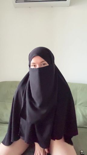 Islamic burka, sitting on couch