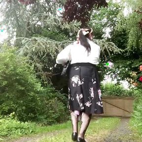 Dressed with a black midi skirt with flowers for a night out