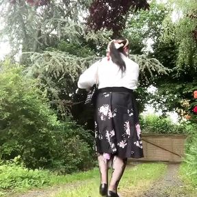 Dressed with a black midi skirt with flowers for a night out