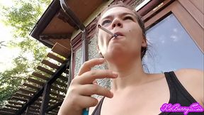 Smoking early in the morning in front of the house