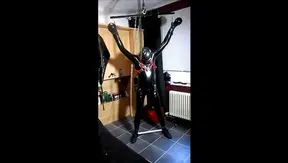 Rubber Slave Gets Pegged and Chained in Intense Latex Bondage Scene