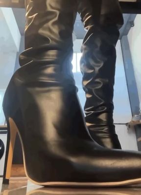 Big-ass goddess shows off her boots and stockings
