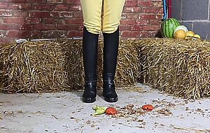 Equestrian Louisa crushing fruit wearing boots