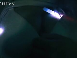 Carlycurvy plays with glow sticks whilst rubbing large tits and clitoris down