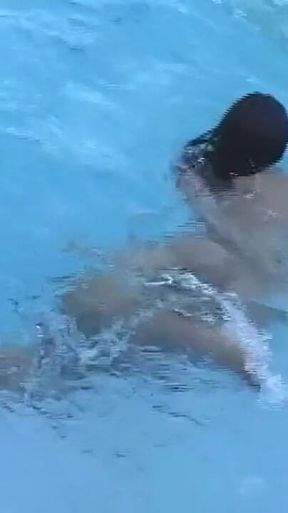 Hot Young Shemale Gets a Naked Swim in the Pool