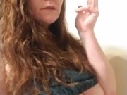Sexy red head smoking and playing with titties