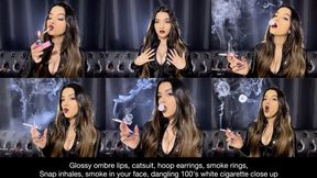 Ombre lips, pvc catsuit, hoop earrings, smoke rings, snap inhales, smoke in your face, long nails, dangling 100's white cigarette close up!