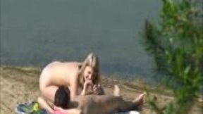 Extremely sexy blondie gives a head to her BF at public beach