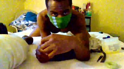 Masked lad plays with his ass in front of the camera