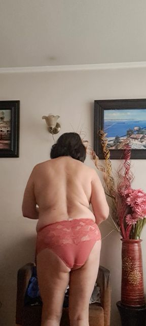 in underwear tidying up and the neighbor watching