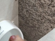 Cumming at public urinal