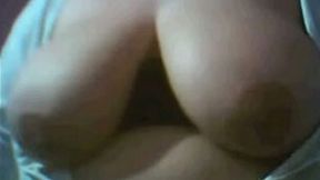Exposing her sexy and massive titties to the cmaera