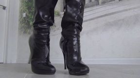 She cut the black boots with scissors and tore them with her hands a