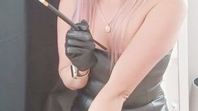 Sexy smoking in black leather dress flashing underwear