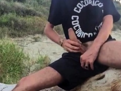 He wanks in the dunes