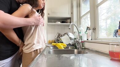 I was doing the dishes but my horny husband didn't let me finish and fucked me from behind in the kitchen