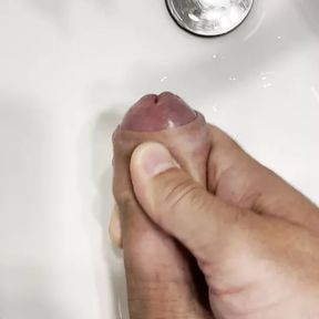 Masturbating with cumshot in a sink