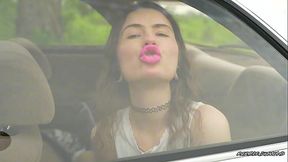 Messy Pink lipgloss marks on the Car Window