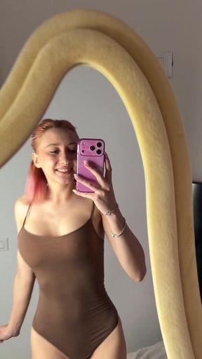 Tease in a red dress pulls down her straps