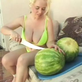 Kinky dude and blonde with huge tits get playful with a water melon then fuck outdoors