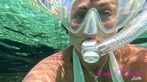 Carissa in the white bikini underwater with the scooter