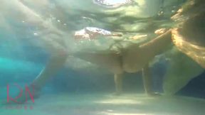 Elegant and flexible babe, swimming underwater in the outdoor swimming pool. 3 2