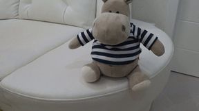 A plush toy on my crossed legs c