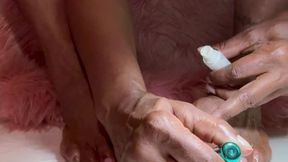 Naked self-care applying polish at home in peacefully quiet before bed