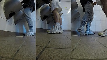 Amateur boys in sneakers wank and try handjob in public toilets' urinal