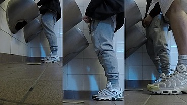 Amateur boys in sneakers wank and try handjob in public toilets' urinal