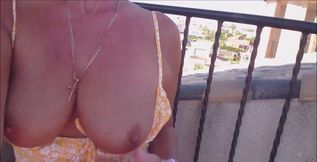 Flashing my tits ass and pussy, outside on my balcony wearing an orange floral outfit