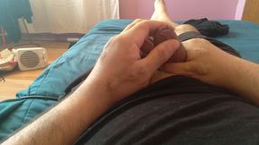 Gay man masturbates his large penis with great passion.