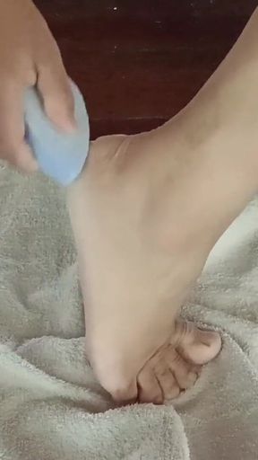 Barefoot Woman Getting a Pedicure