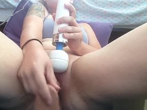 Mature wife sitting with legs spread and masturbating