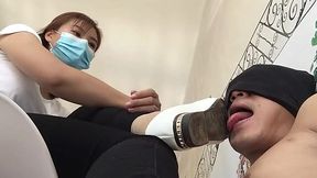 Asian dominates her feet over a sissy blindfolded slave