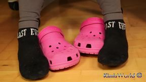 Under Desk Foot Play - Pink Clogs and Worn Socks