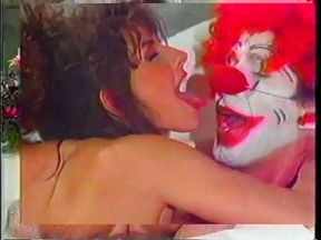 Sexy brunette with a fantastic ass loves doggy style fucking from a clown