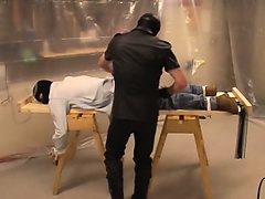 Dude in jeans gets tied down and has his ass dominated by a gimp
