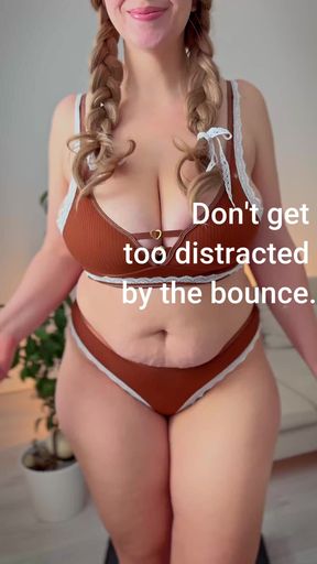 A MILF with a huge bum is walking on the treadmill and her boobs are bouncing.