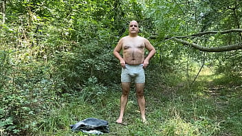 Zolee undresses in the forest and then cums