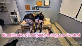 Wrapped in Submission: Two Dommes, One Helpless Toy