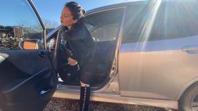 lady in black suede boots pedal pumping and smoking in the car m0