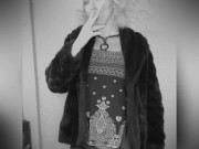 Smoking in fur coat.